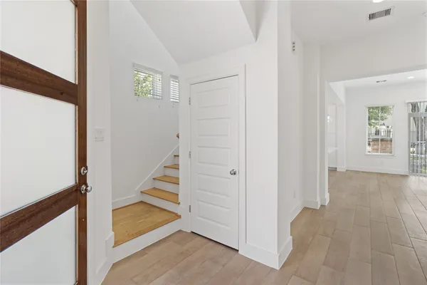 a view of a hallway with staircase