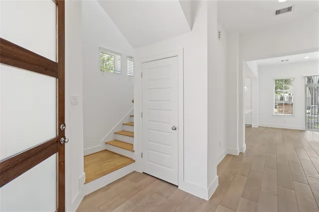 a view of a hallway with staircase