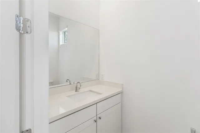 a bathroom with a sink and mirror