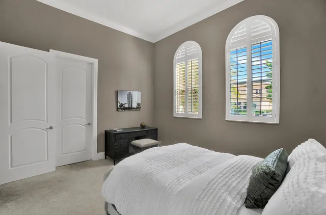 a bedroom with a bed and a closet