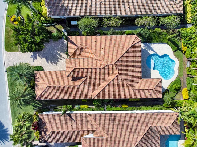 an aerial view of a house with garden space and plants