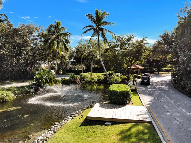 a small pool with couple of relaxing chair