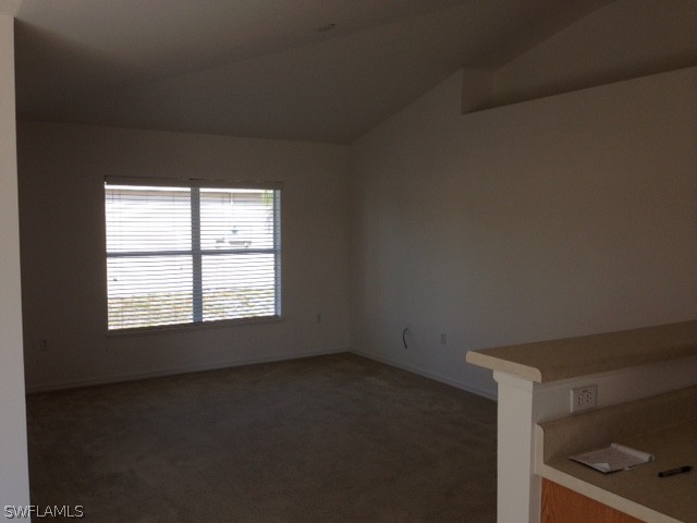 3207 54th Street West Lehigh Acres, FL 33971 - Photo 4 of 10 an empty room with a window