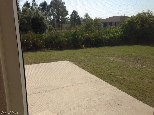 3207 54th Street West Lehigh Acres, FL 33971 - Photo 5 of 10 a view of a backyard