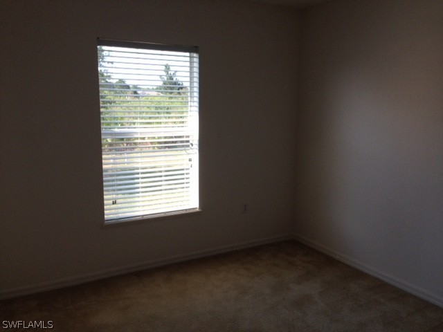 3207 54th Street West Lehigh Acres, FL 33971 - Photo 7 of 10 a view of an empty room with a window