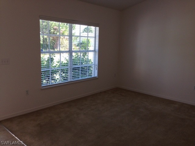 3207 54th Street West Lehigh Acres, FL 33971 - Photo 9 of 10 an empty room with a window