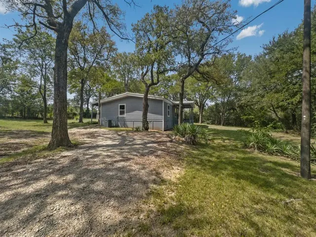 a house view with a garden space