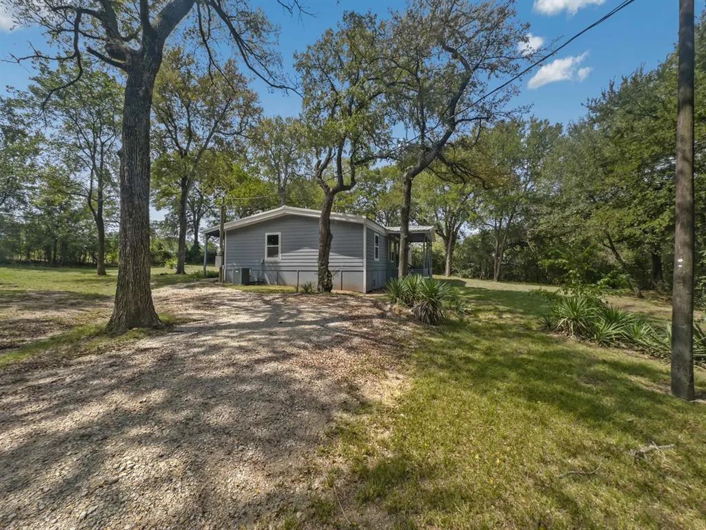 408 West Bells Boulevard Bells, TX 75414 - Photo 1 of 1 a house view with a garden space