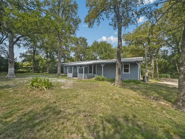 a view of outdoor space with deck and yard