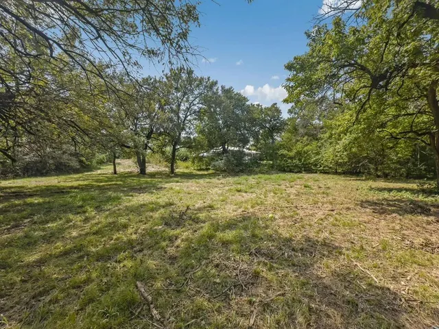 a view of outdoor space with deck and yard