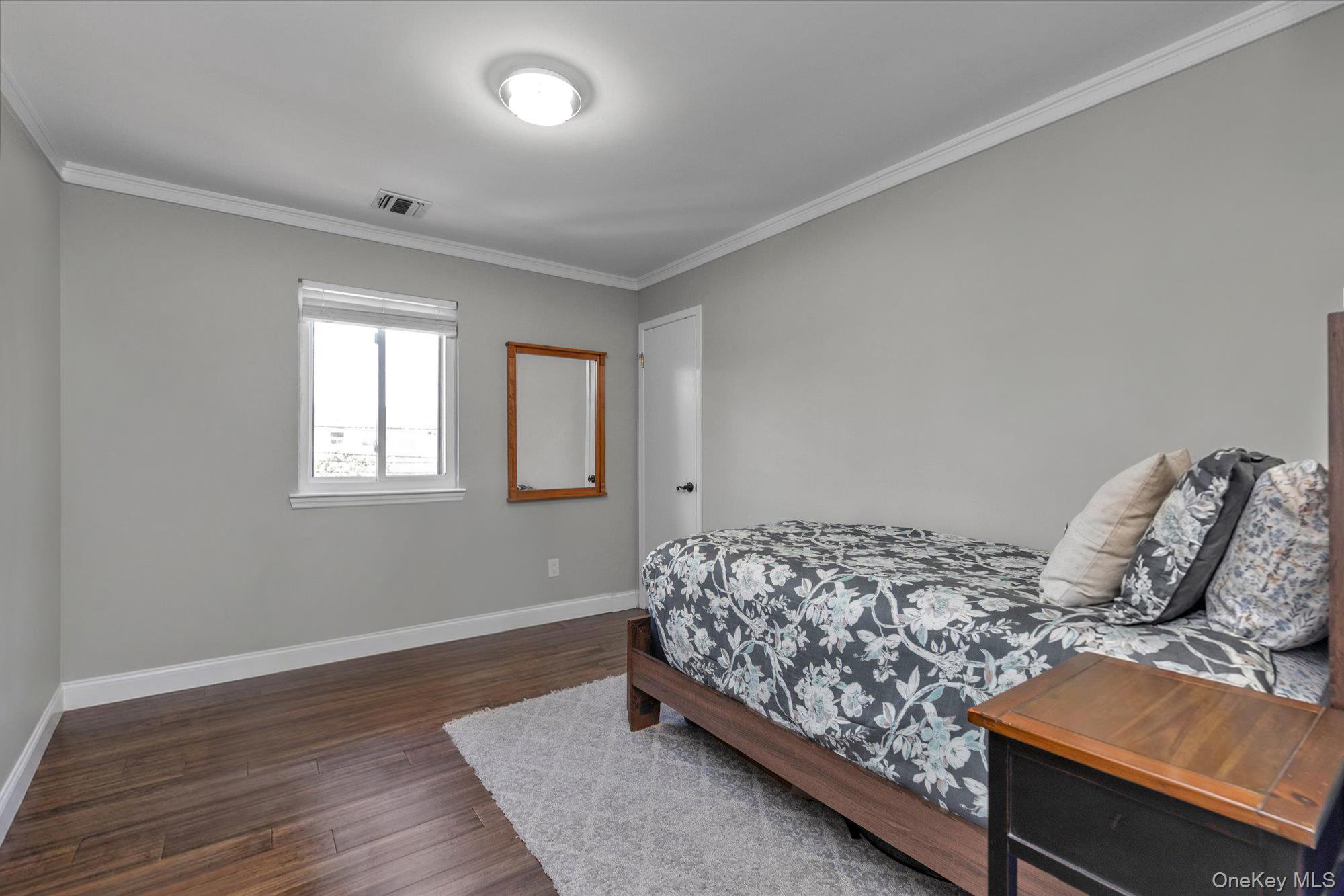 32 Ashley Circle Commack, NY 11725 - Photo 11 of 23 a bedroom with bed and window