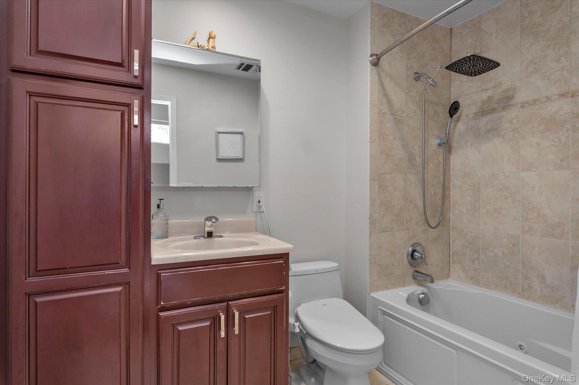 32 Ashley Circle Commack, NY 11725 - Photo 14 of 23 a bathroom with a sink toilet and shower