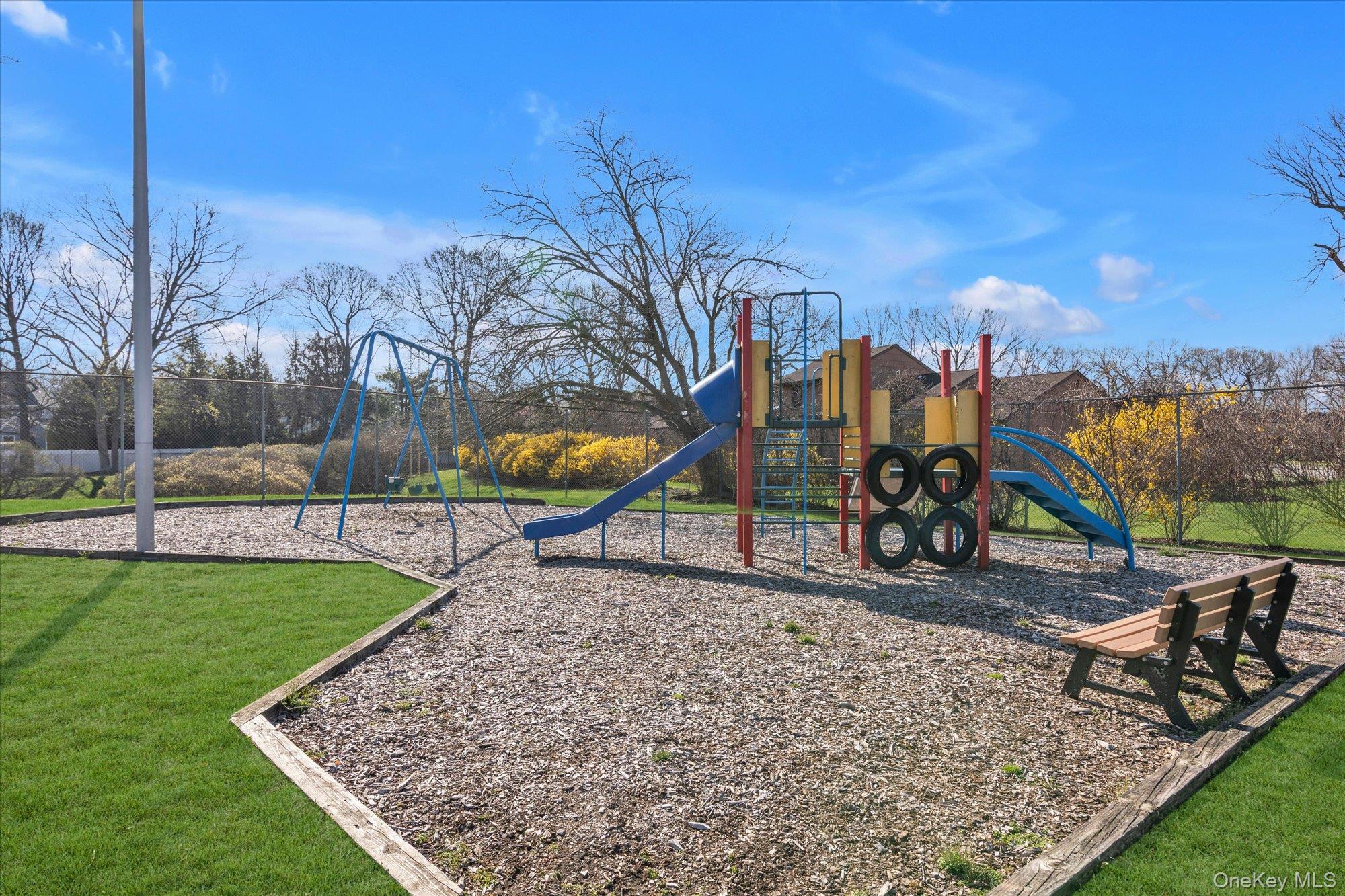 32 Ashley Circle Commack, NY 11725 - Photo 19 of 23 a view of a park with iron fence
