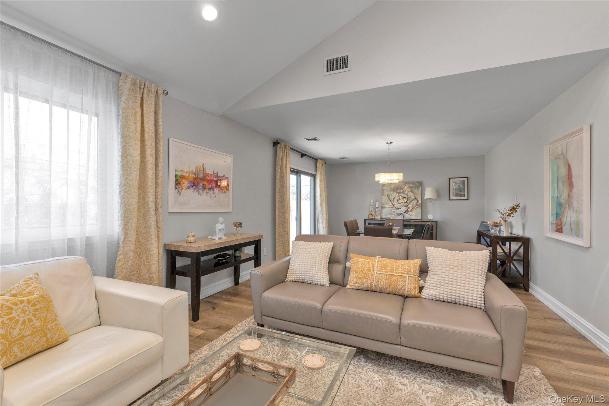 32 Ashley Circle Commack, NY 11725 - Photo 4 of 23 a living room with furniture and a large window