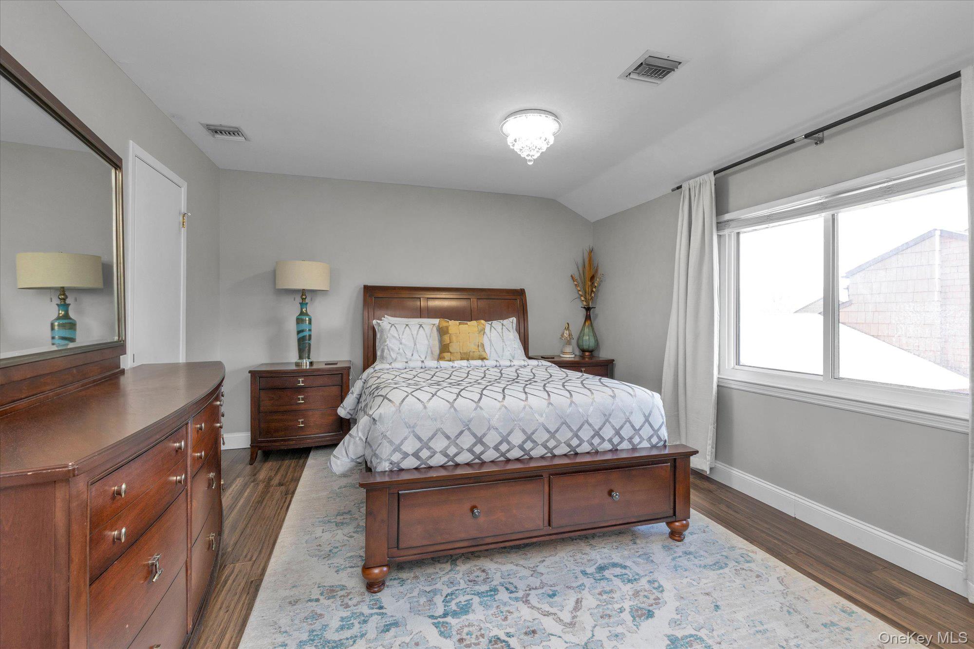 32 Ashley Circle Commack, NY 11725 - Photo 10 of 23 a bedroom with a bed and a dresser