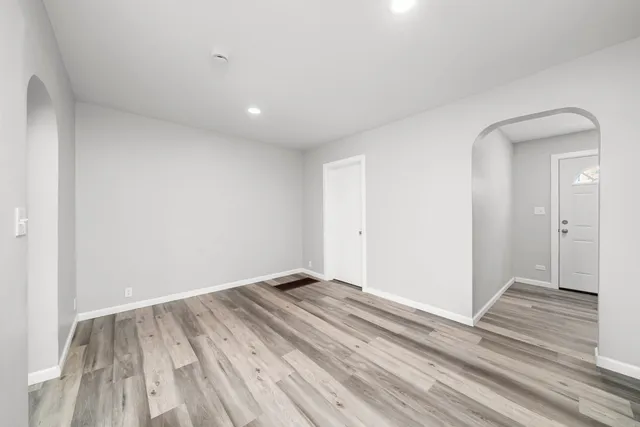 a view of room with wooden floor