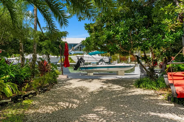 an aerial view of a houses with a lake view