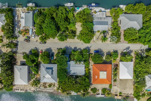 a view of a lake with houses in the back