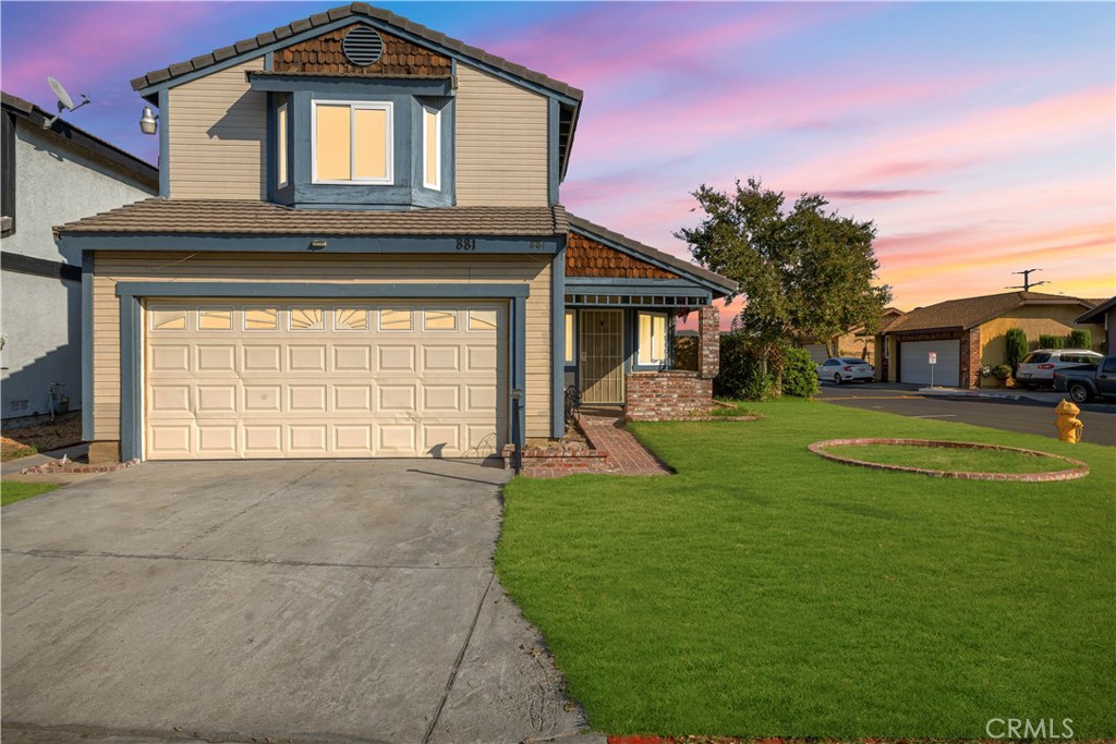 881 South Lamarr Street Rialto, CA 92376 - Photo 2 of 54 a front view of a house with a yard