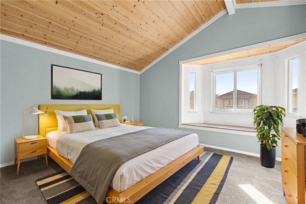 881 South Lamarr Street Rialto, CA 92376 - Photo 21 of 54 a bedroom with a bed and wooden floor