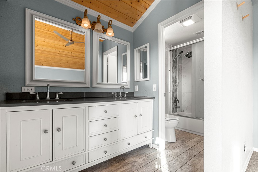 881 South Lamarr Street Rialto, CA 92376 - Photo 24 of 54 a bathroom with a sink and a mirror