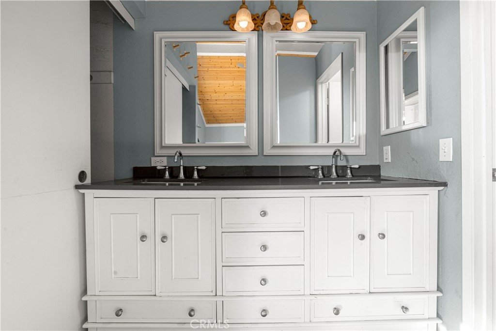 881 South Lamarr Street Rialto, CA 92376 - Photo 25 of 54 a bathroom with a sink and a mirror