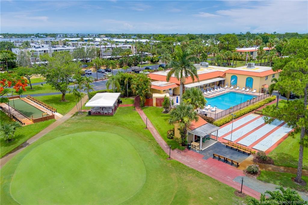 1999 Southwest Palm City Road, Unit G Stuart, FL 34994 - Photo 13 of 23 an aerial view of a house with a garden and lake view