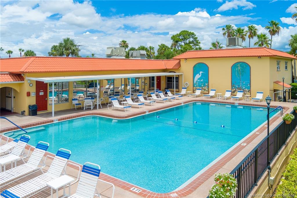 1999 Southwest Palm City Road, Unit G Stuart, FL 34994 - Photo 14 of 23 a view of swimming pool with outdoor seating