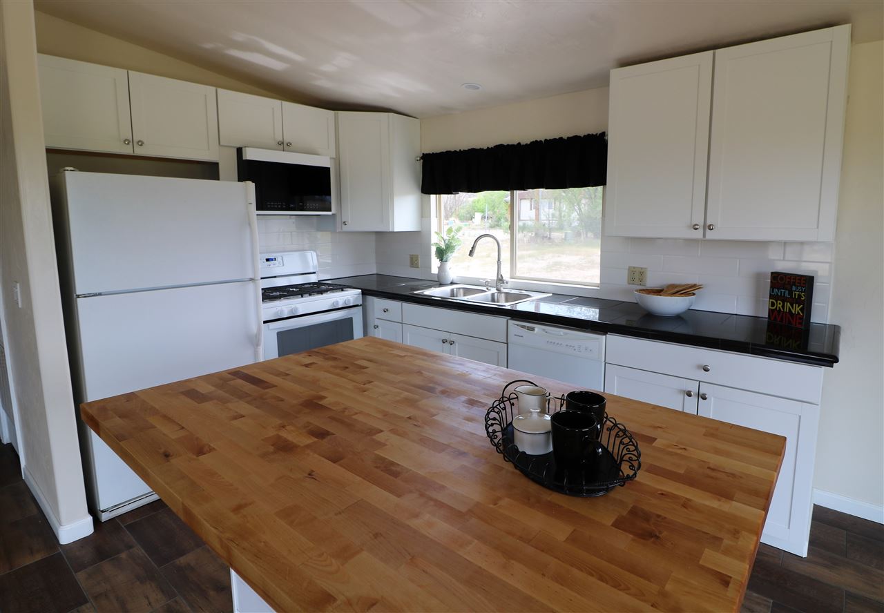 1505 10 Road Mack, CO 81525 - Photo 12 of 27 a kitchen with a sink and a stove top oven