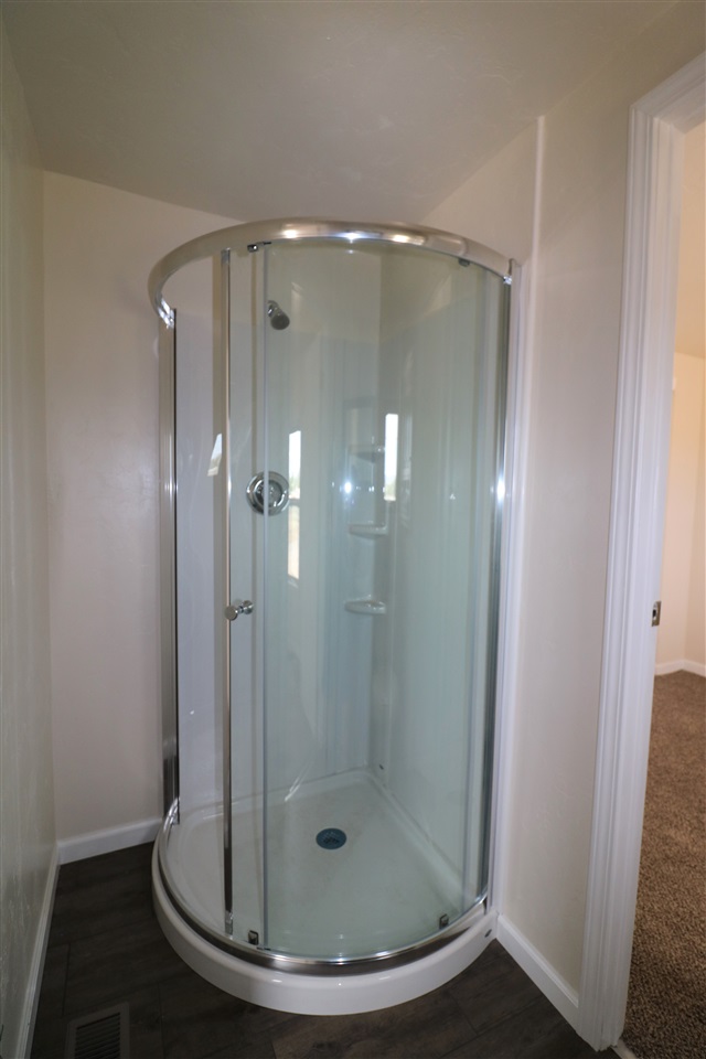 1505 10 Road Mack, CO 81525 - Photo 22 of 27 a bathroom with a glass shower door