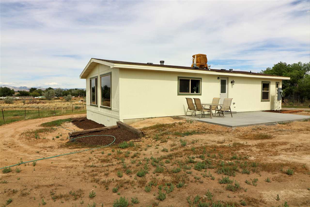 1505 10 Road Mack, CO 81525 - Photo 25 of 27 a front view of a house with yard