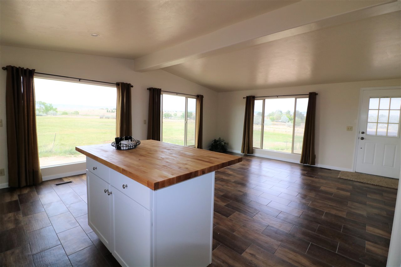 1505 10 Road Mack, CO 81525 - Photo 4 of 27 a kitchen with sink and wooden floor