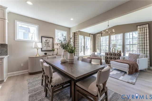 a spacious bedroom with two beds and a large window