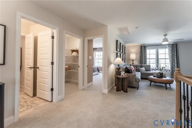 a view of a livingroom with furniture and windows