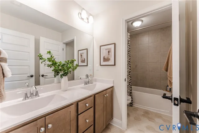 a spacious bedroom with a bed and wooden floor