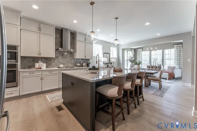 a kitchen with counter space appliances a sink and a center island