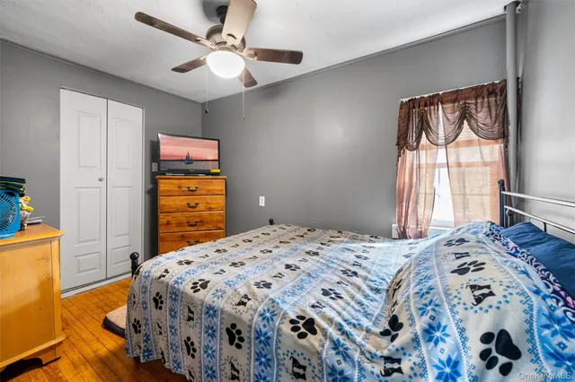 a bedroom with a bed and a dresser