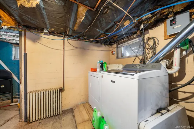 a view of a house with a wooden fence