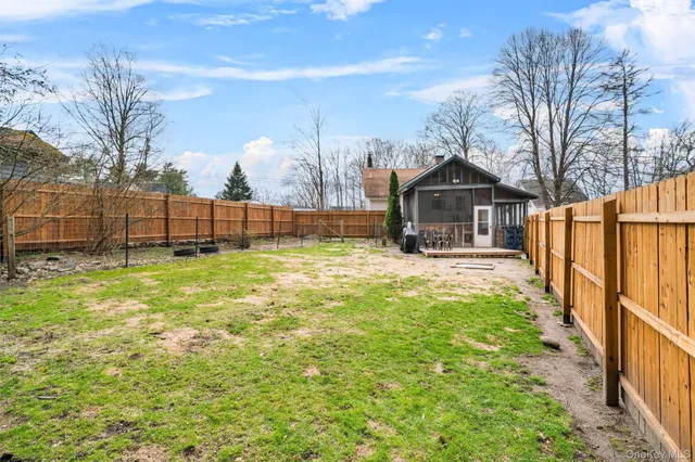 a view of a two chairs in the balcony