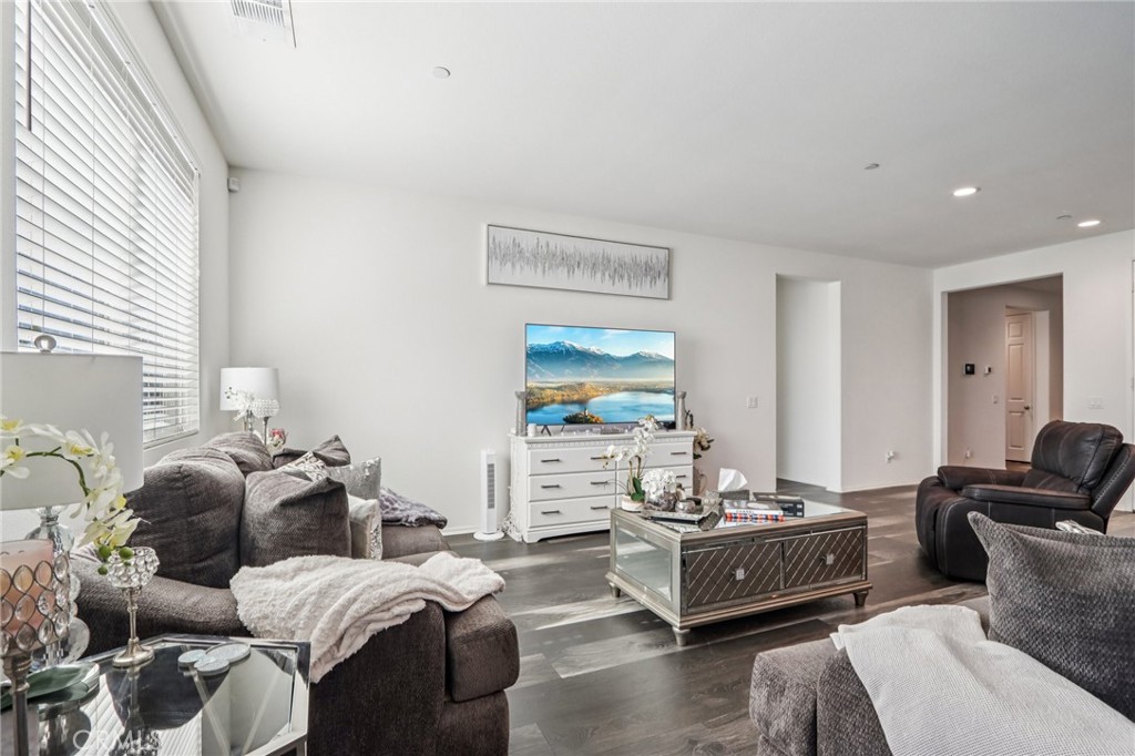 45643 Sancroft Avenue Lancaster, CA 93535 - Photo 5 of 18 a living room with furniture and a flat screen tv