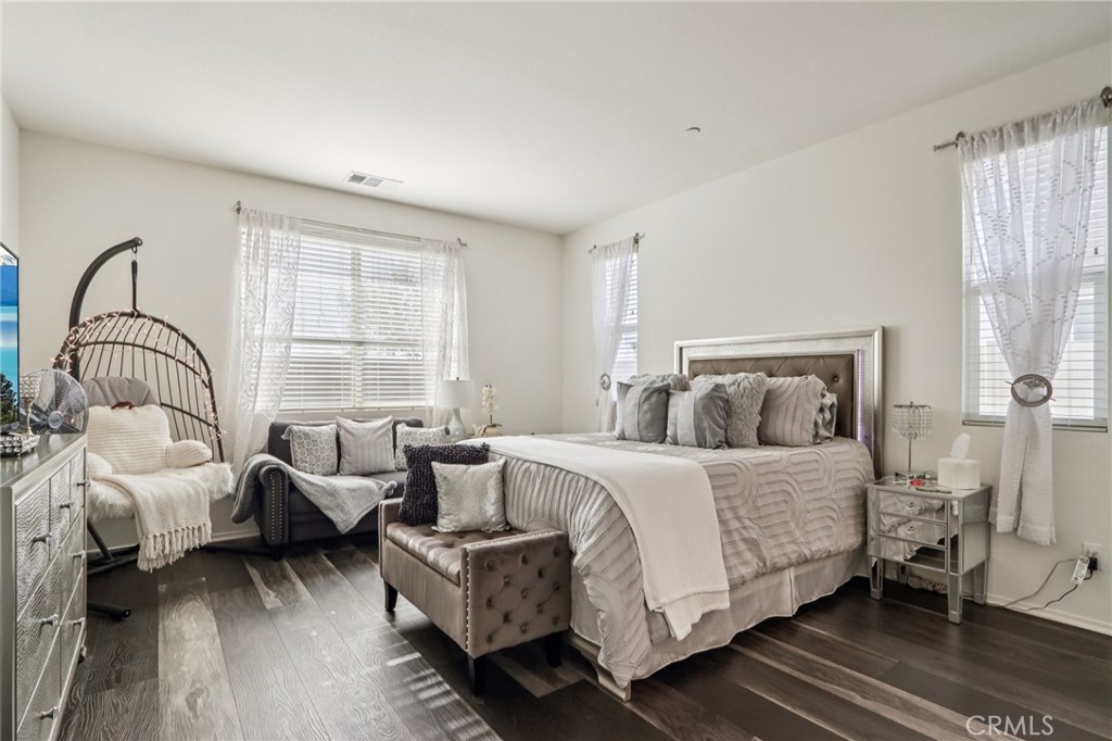 45643 Sancroft Avenue Lancaster, CA 93535 - Photo 9 of 18 a bedroom with a bed and a couch