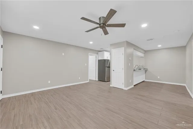 a kitchen with stainless steel appliances a sink and cabinets