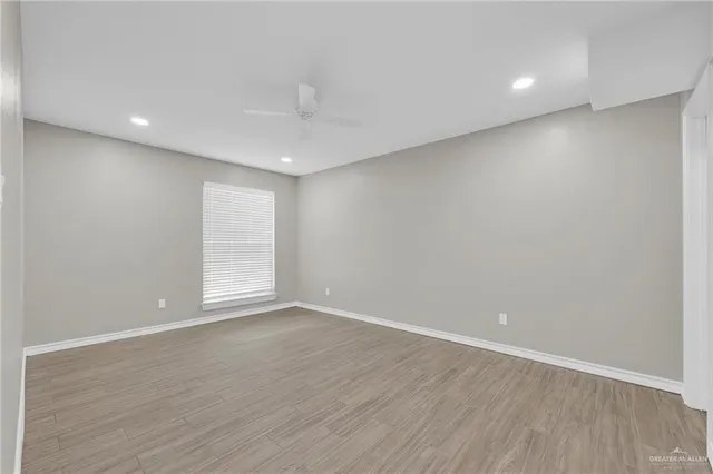 a bathroom with a granite countertop sink a toilet and bathtub