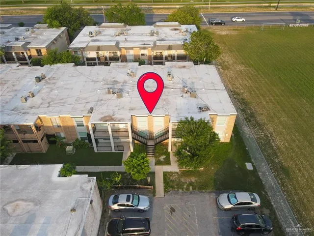 an aerial view of residential houses with outdoor space