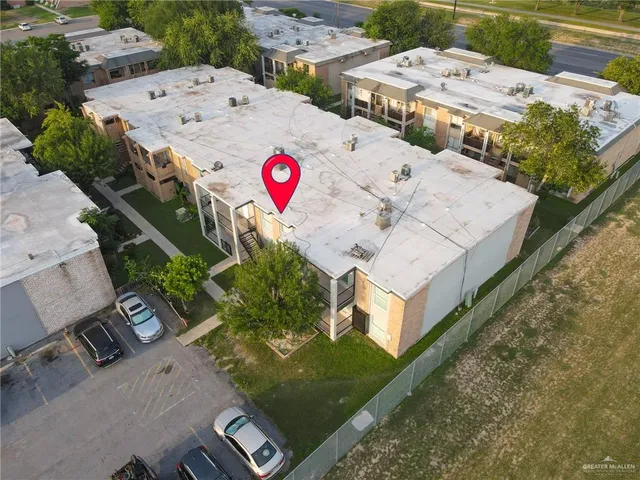 an aerial view of a house with a garden