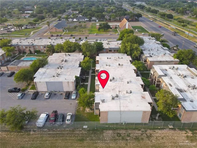 an aerial view of multiple houses with outdoor space