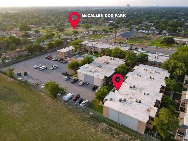an aerial view of residential houses with outdoor space