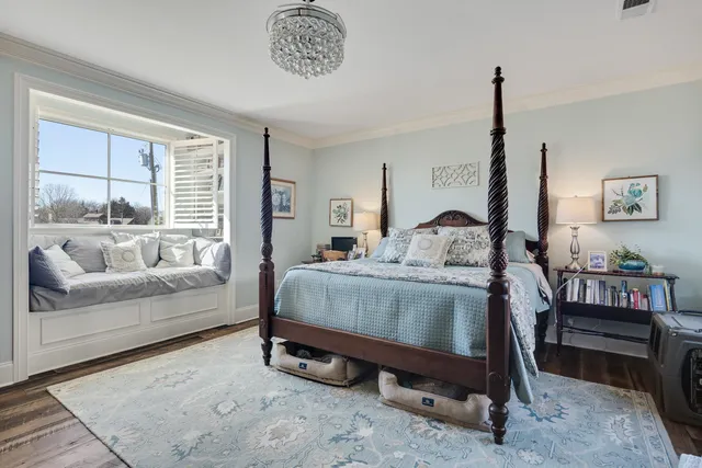 a bedroom with a bed and a couch