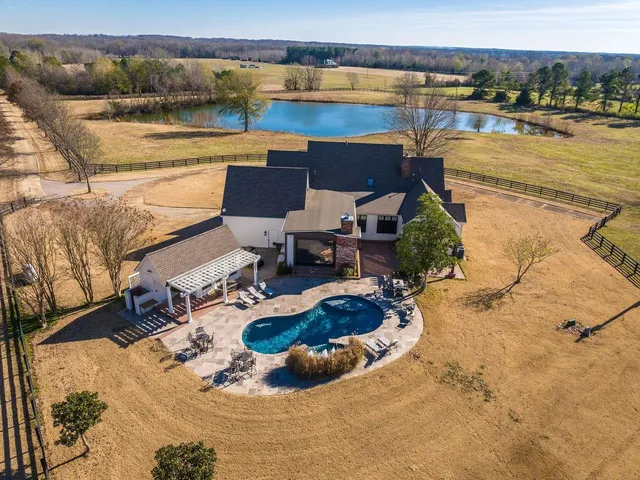 a view of a swimming pool and lounge chair