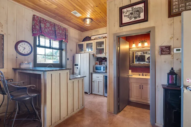 a view of entryway with kitchen and furniture
